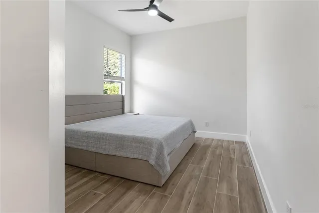 a bedroom with a bed and window