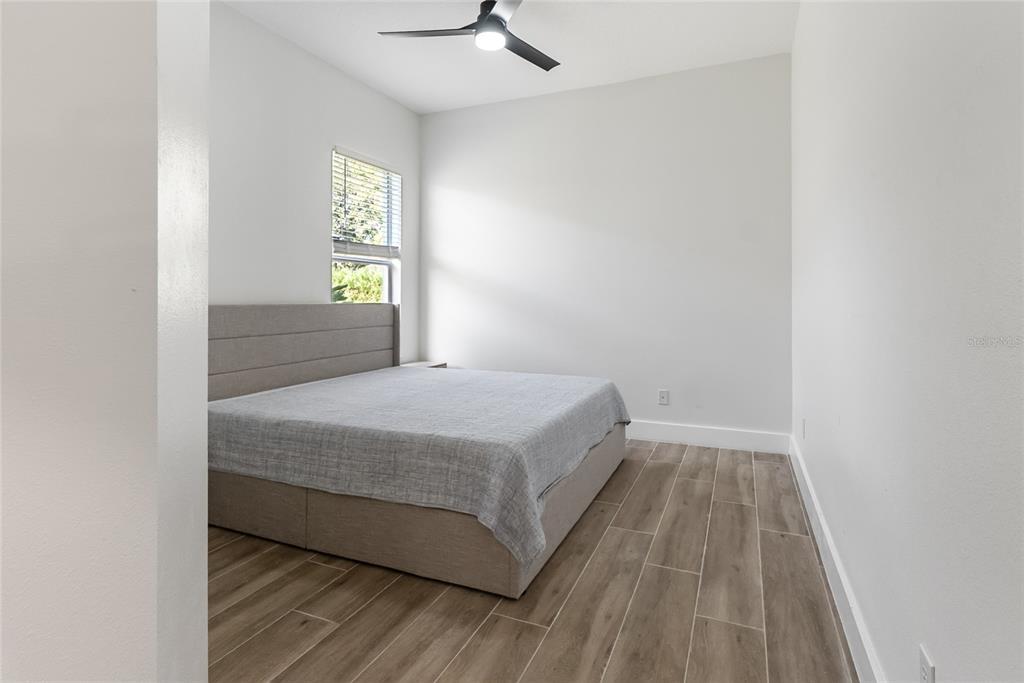 12516 24th Street East Parrish, FL 34219 - Photo 13 of 47 a bedroom with a bed and window