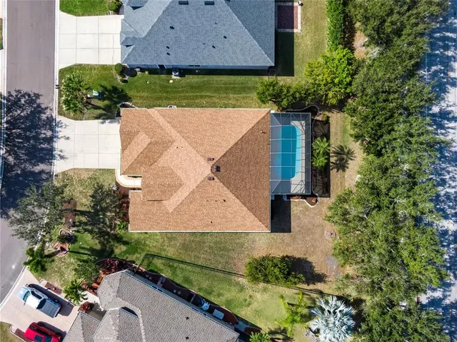 an aerial view of residential houses with outdoor space