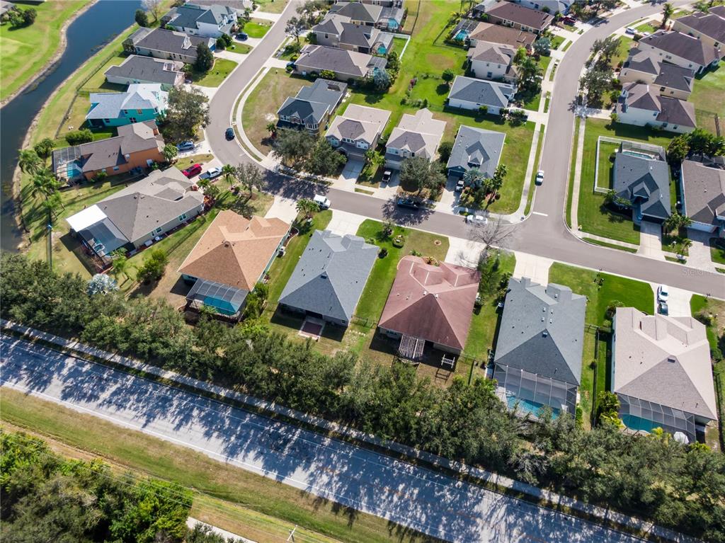 12516 24th Street East Parrish, FL 34219 - Photo 41 of 47 an aerial view of residential house with outdoor space and swimming pool