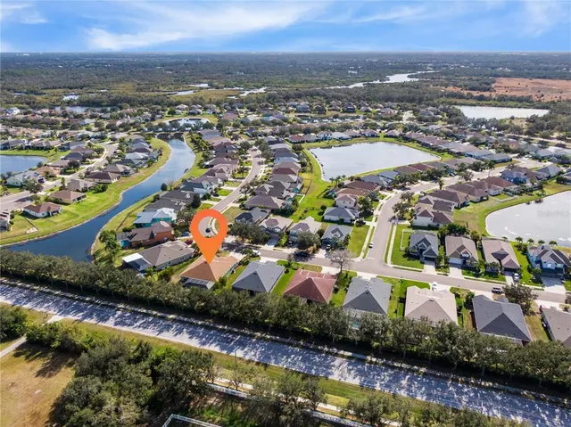 an aerial view of residential building with parking