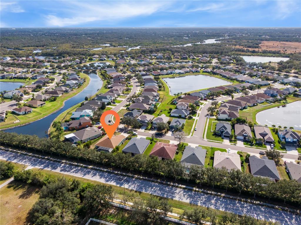 12516 24th Street East Parrish, FL 34219 - Photo 42 of 47 an aerial view of residential houses with outdoor space