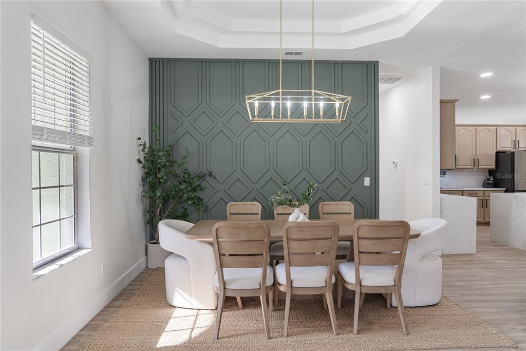 12516 24th Street East Parrish, FL 34219 - Photo 5 of 47 a view of a dining room with furniture and chandelier