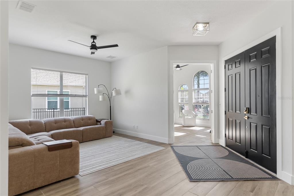 12516 24th Street East Parrish, FL 34219 - Photo 8 of 47 a living room with furniture and a large window