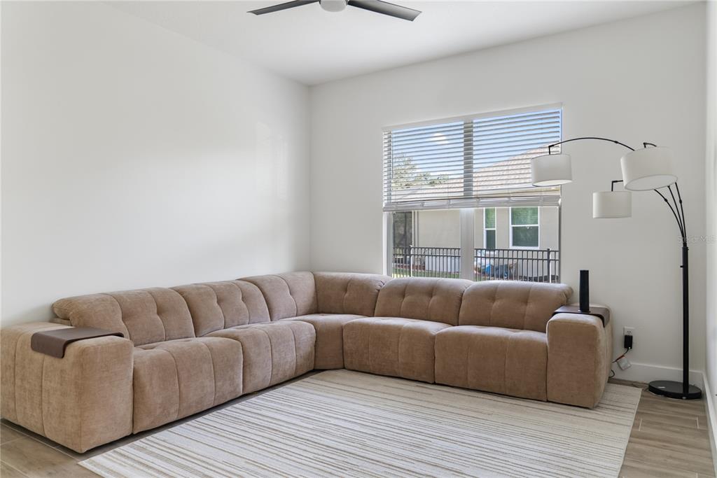 12516 24th Street East Parrish, FL 34219 - Photo 9 of 47 a living room with furniture and a large window