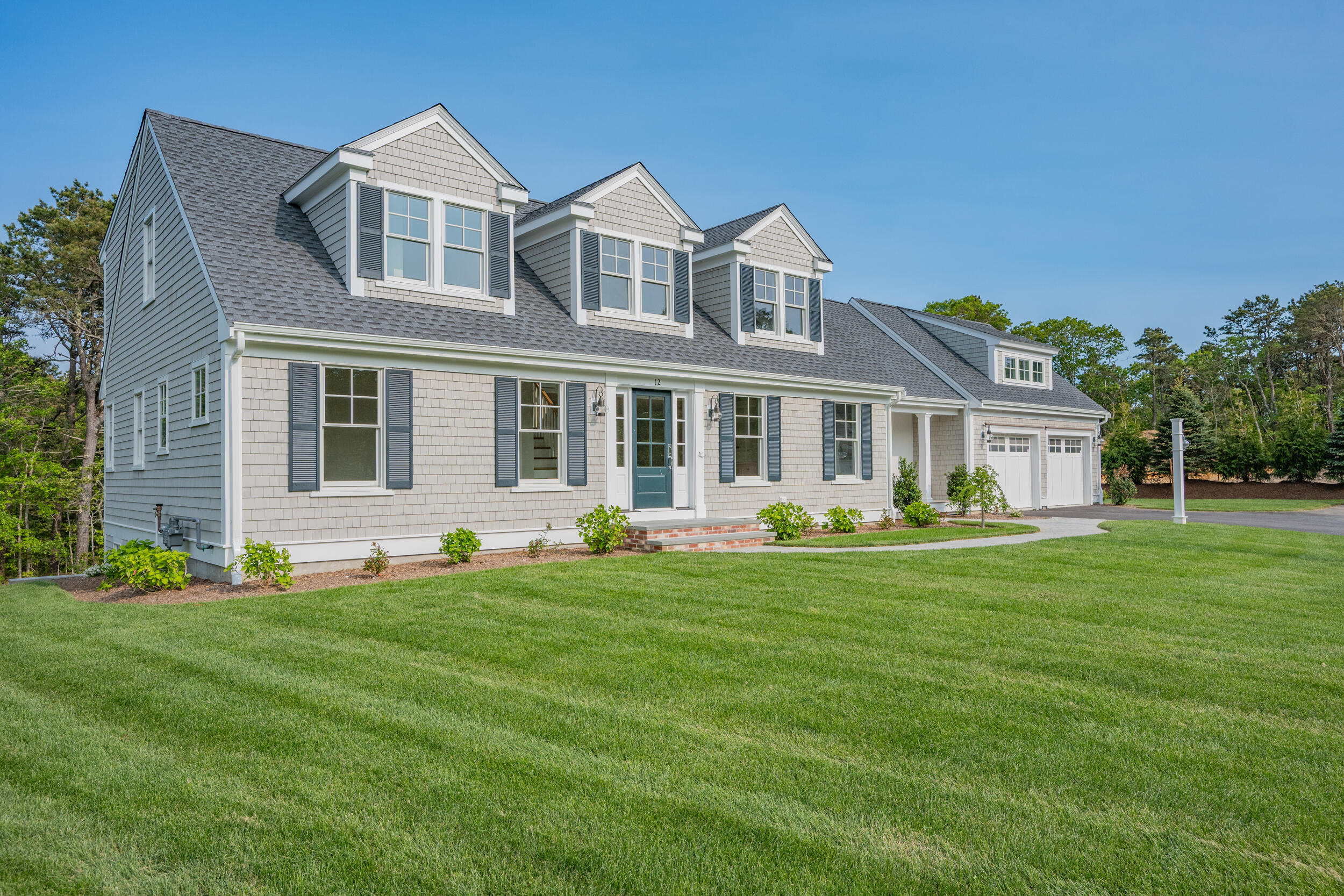 16 Bascom Hollow Harwich, MA 02645 - Photo 1 of 24 a front view of a house with a yard
