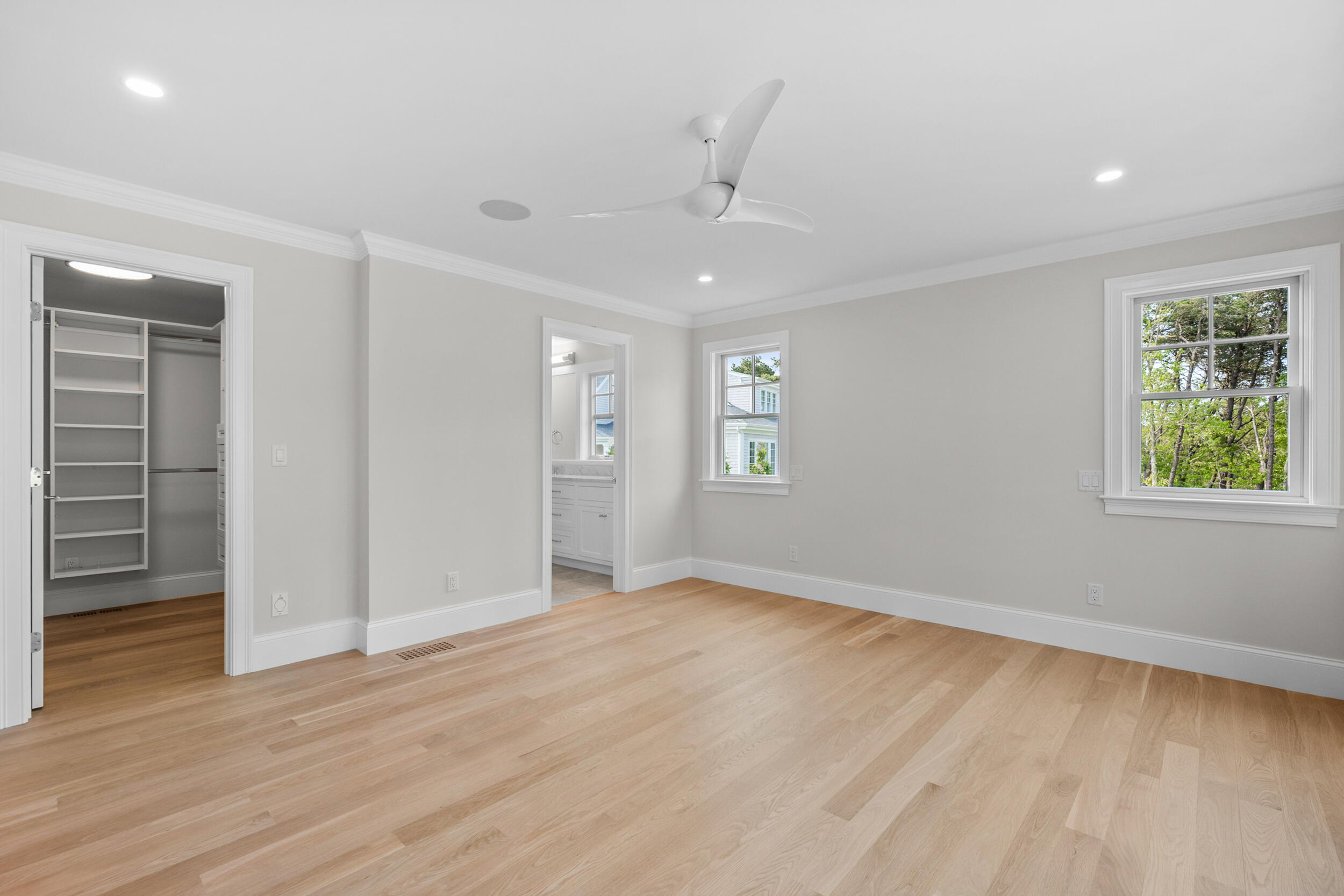 16 Bascom Hollow Harwich, MA 02645 - Photo 14 of 24 an empty room with wooden floor cabinet and windows