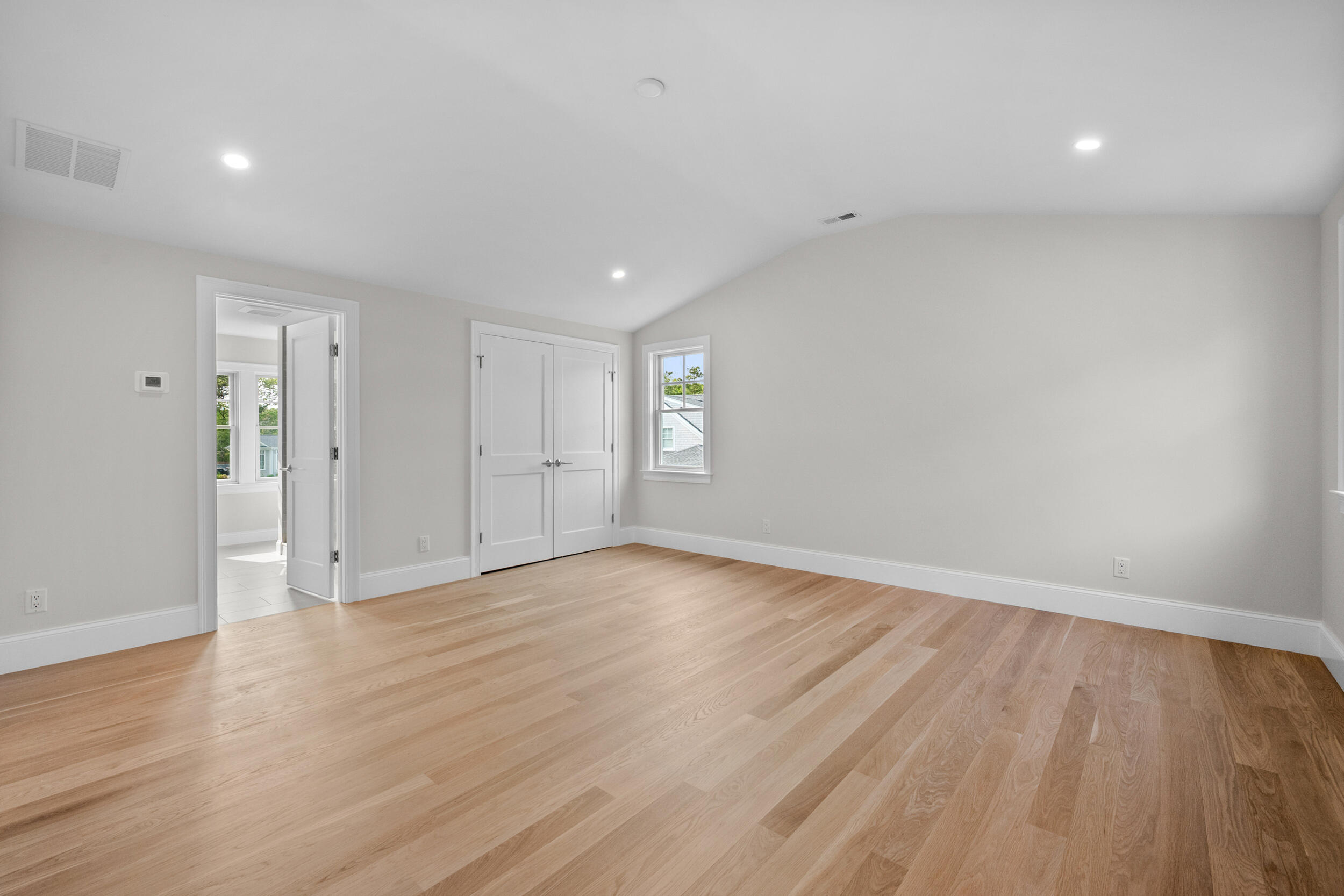 16 Bascom Hollow Harwich, MA 02645 - Photo 18 of 24 a view of an empty room with wooden floor and window