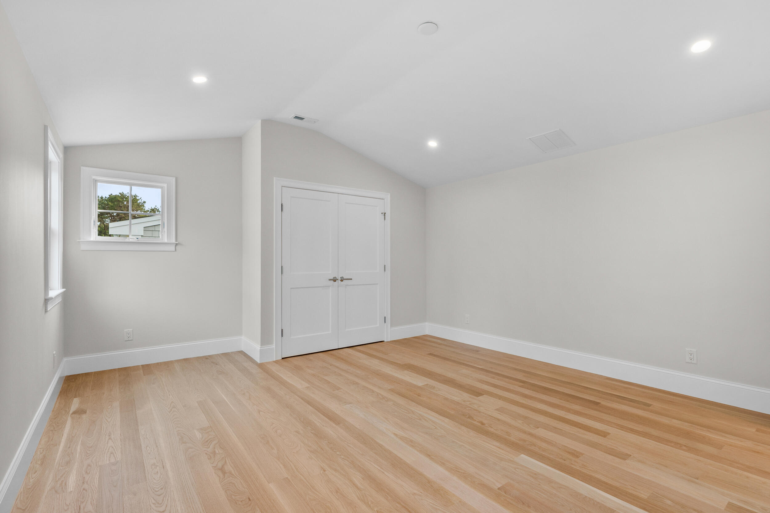16 Bascom Hollow Harwich, MA 02645 - Photo 20 of 24 a view of empty room with wooden floor and fan