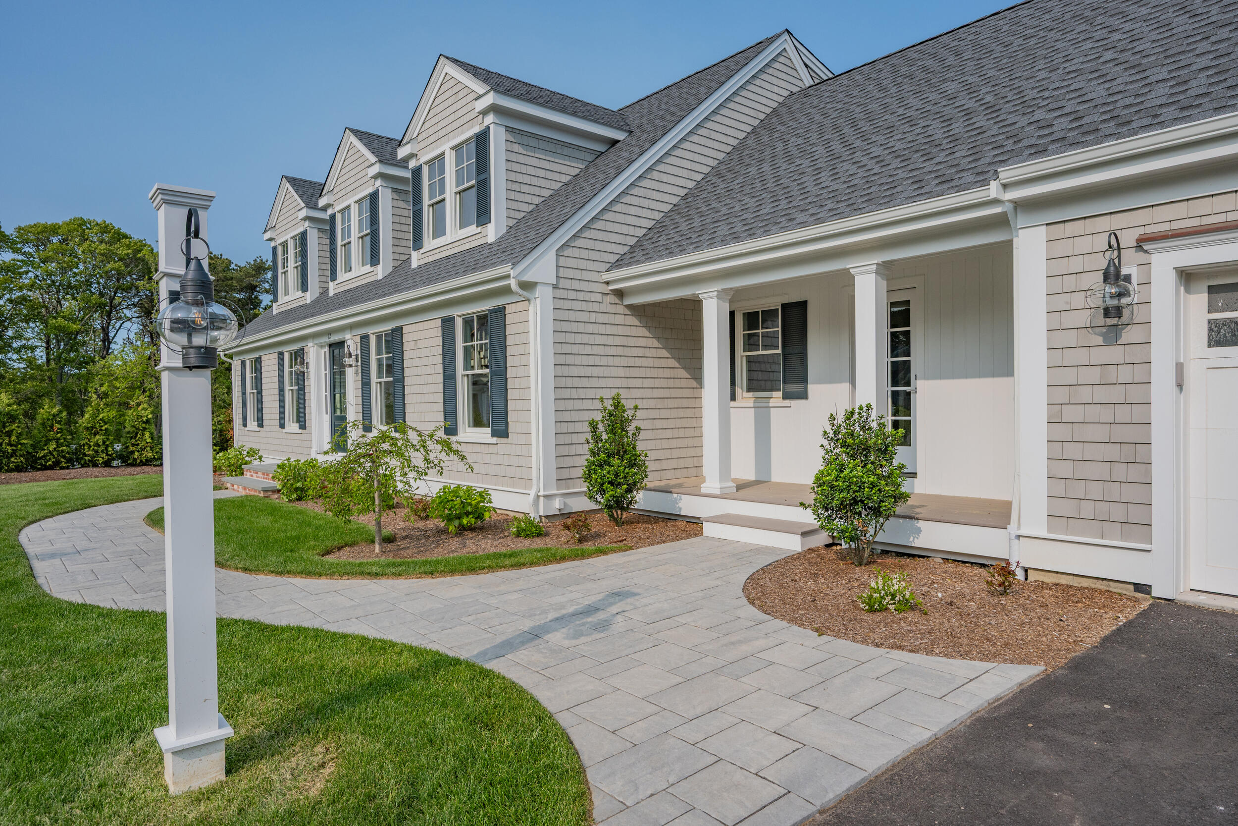 16 Bascom Hollow Harwich, MA 02645 - Photo 2 of 24 a front view of a house with garden
