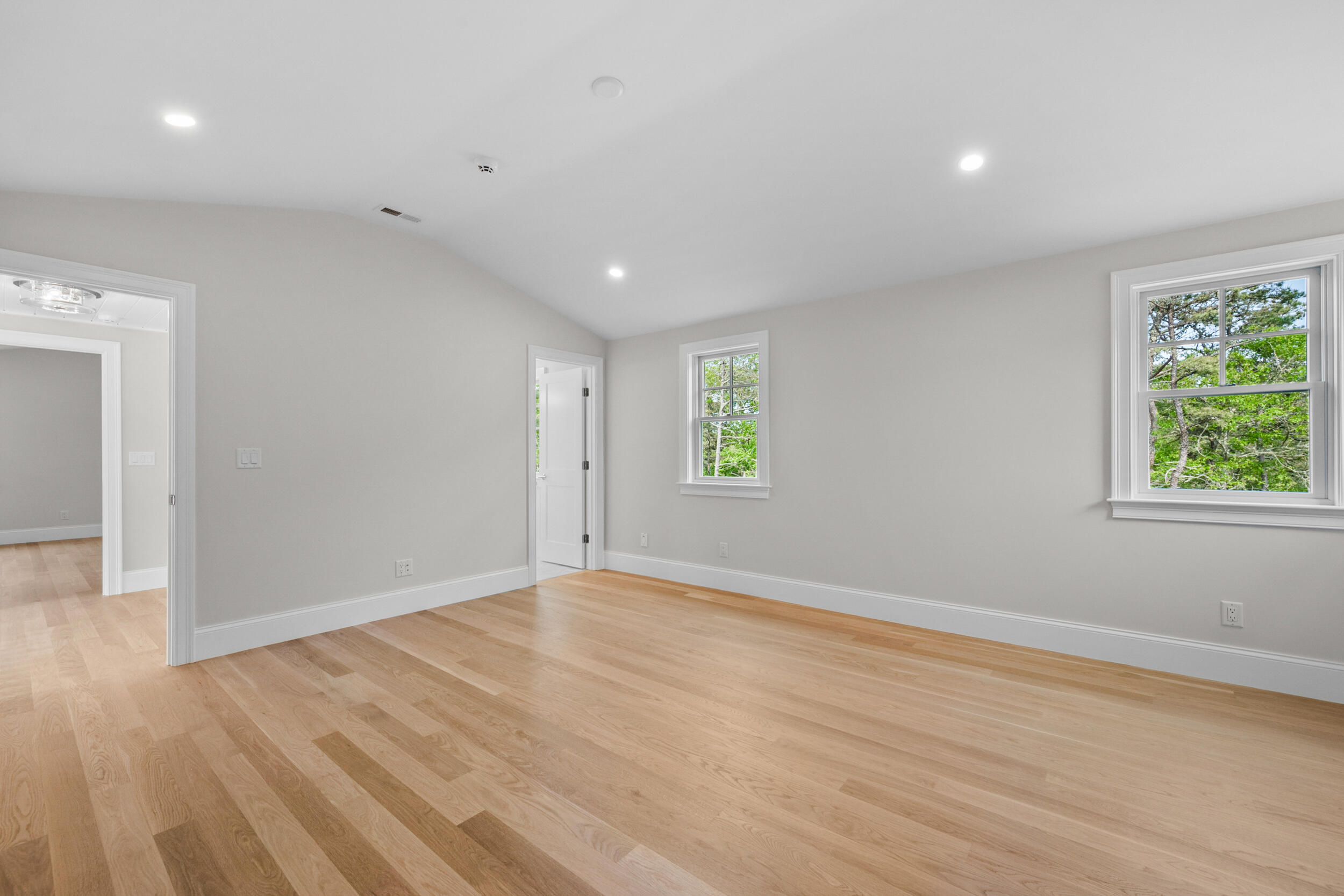 16 Bascom Hollow Harwich, MA 02645 - Photo 22 of 24 an empty room with wooden floor and windows