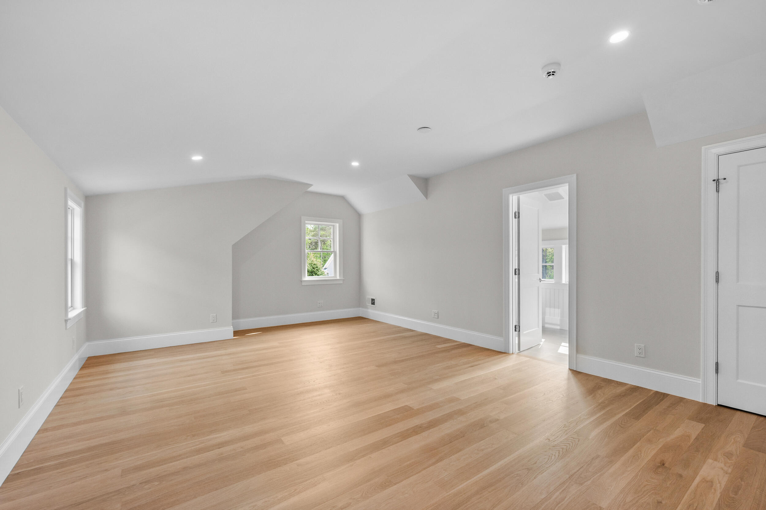 16 Bascom Hollow Harwich, MA 02645 - Photo 23 of 24 an empty room with wooden floor and windows