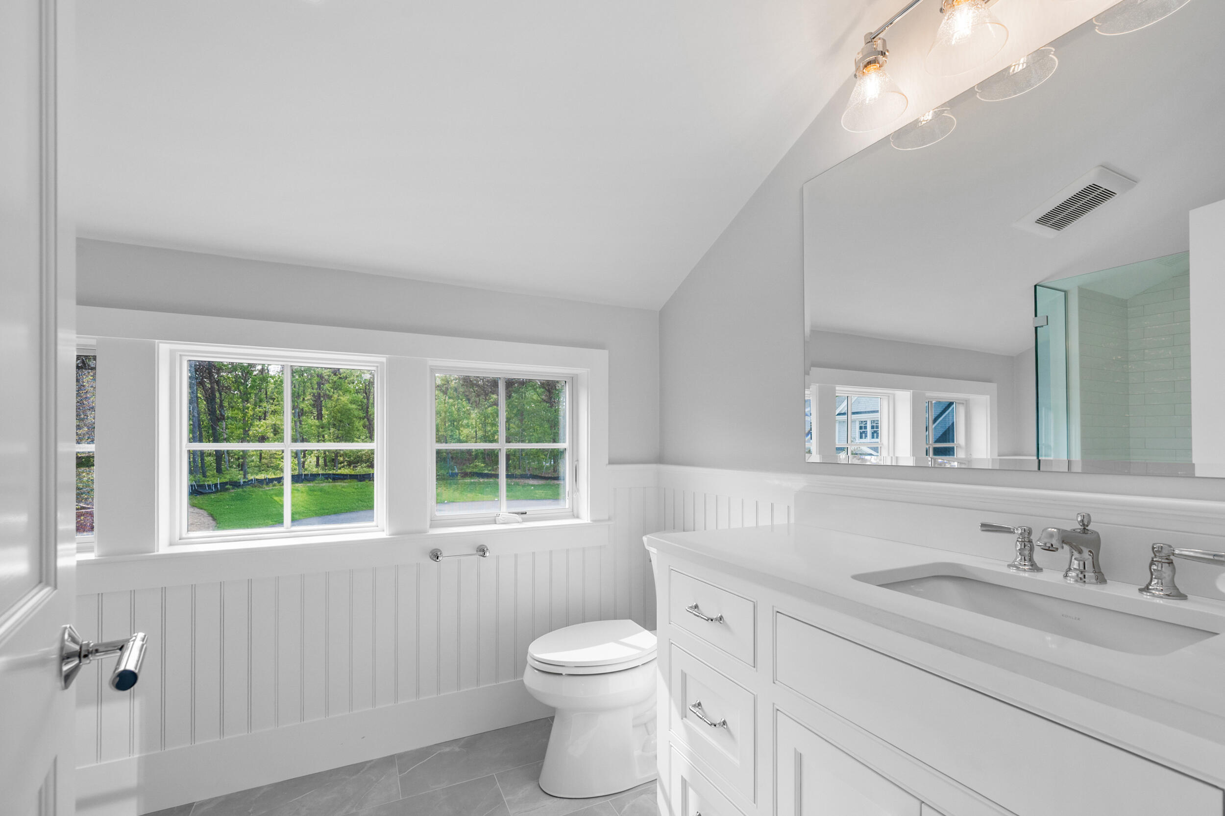 16 Bascom Hollow Harwich, MA 02645 - Photo 24 of 24 a bathroom with a granite countertop sink toilet a large mirror next to a window