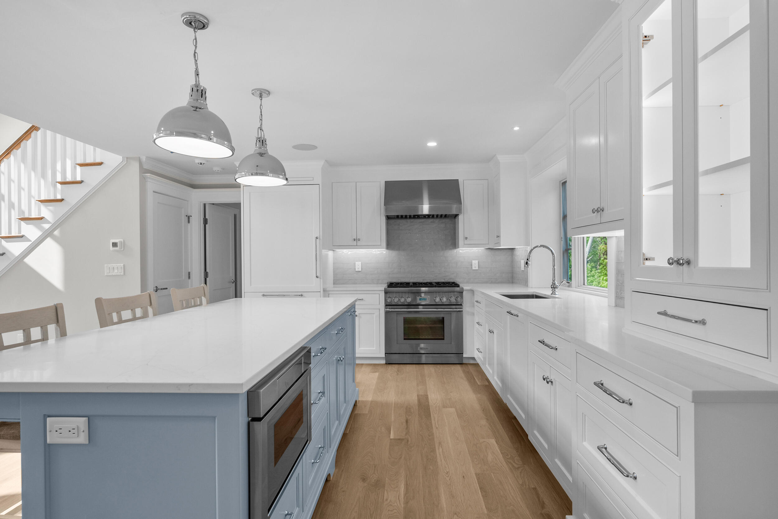 16 Bascom Hollow Harwich, MA 02645 - Photo 7 of 24 a kitchen with a sink stainless steel appliances and cabinets