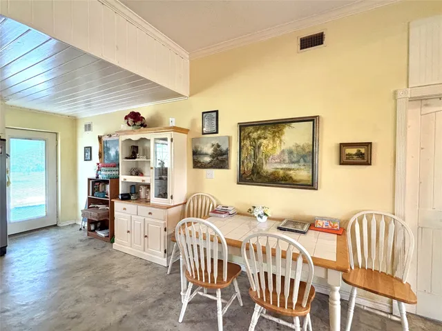 a bedroom with furniture and wooden floor
