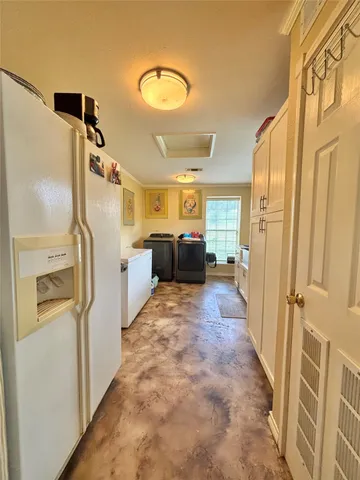 a kitchen with stainless steel appliances granite countertop a refrigerator and a stove