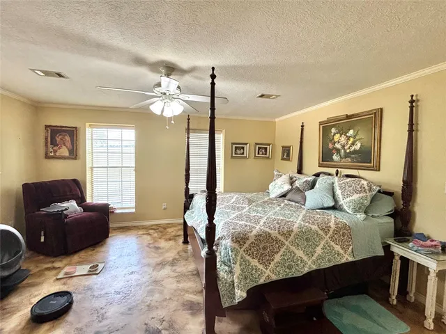 a view of a bedroom with closet and cabinet