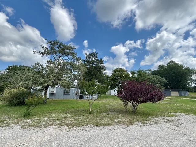 a view of a house with a big yard