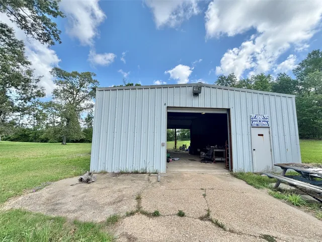 a view of a kitchen with furniture and a sink