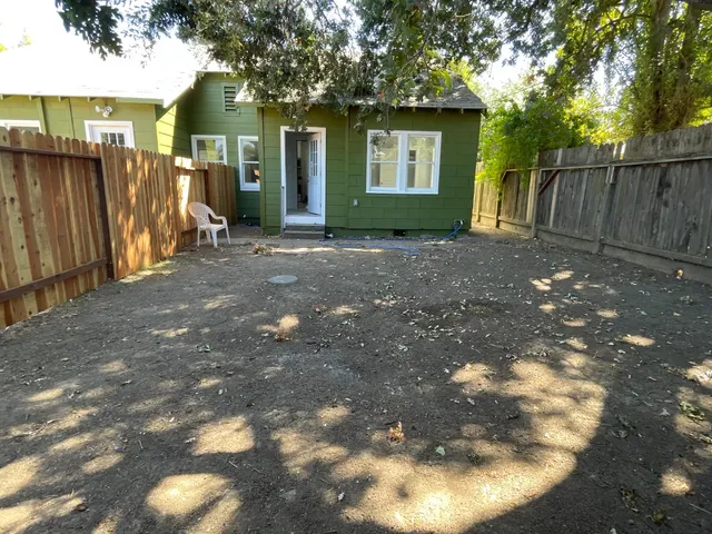 a view of backyard of a house