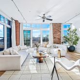 a living room with furniture fireplace and flat screen tv