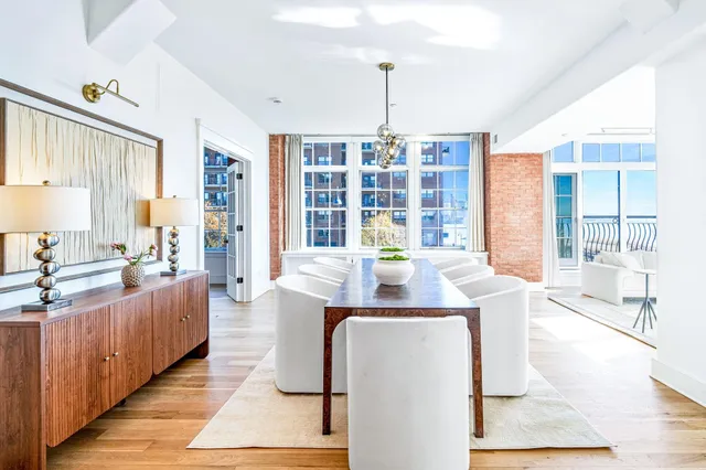 a dining room with furniture and window