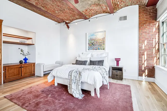 a bed room with a bed and a couch