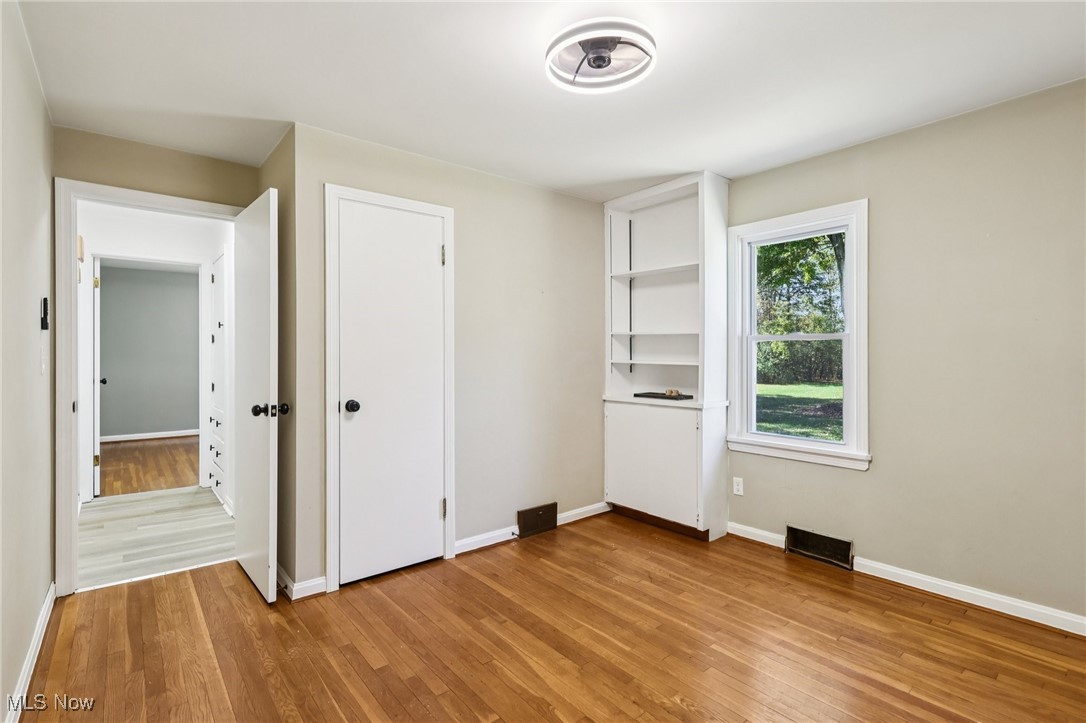 5898 Keller Road Akron, OH 44319 - Photo 14 of 32 Unfurnished bedroom featuring light wood-style flooring and baseboards