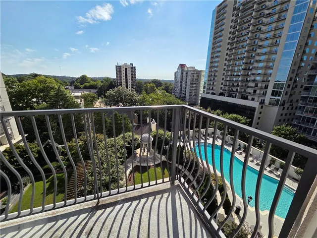 a view of balcony with wooden floor