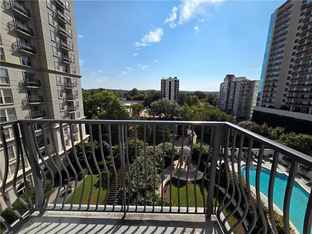 a view of roof deck with two chairs and wooden floor
