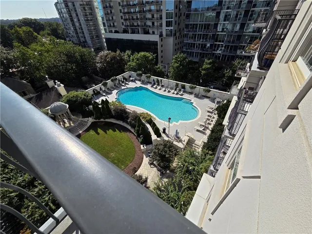 a view of a chairs and table in the balcony