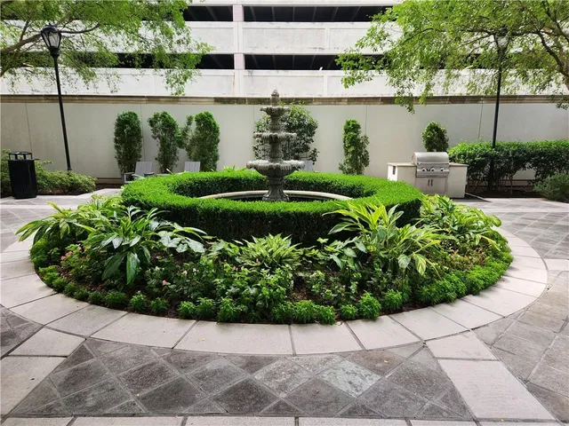 a view of a garden with a fountain