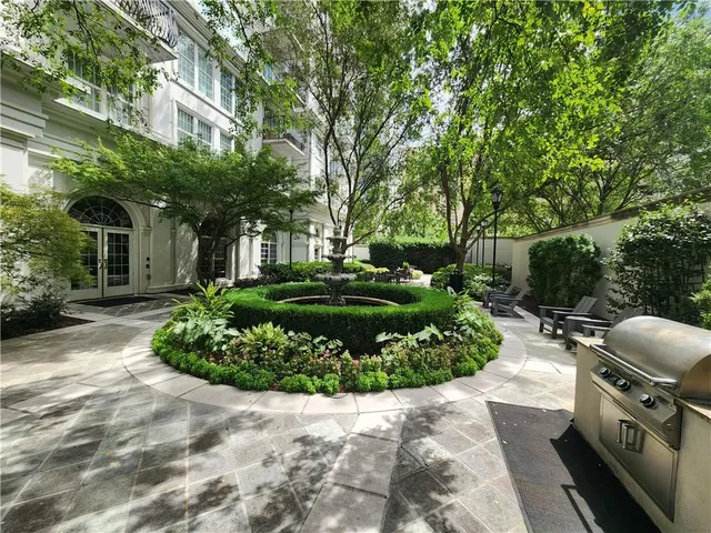 a view of a garden with a fountain