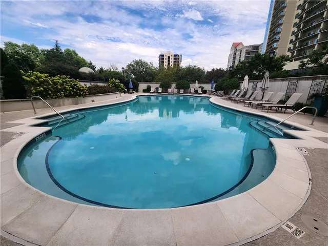 a view of a swimming pool with a lake