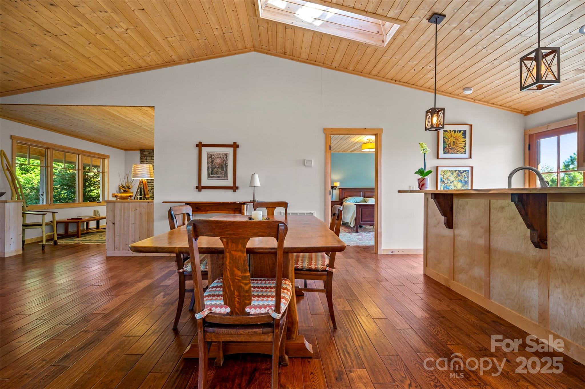 891 Meadow Crest Road Tryon, NC 28782 - Photo 11 of 47 a view of a dining room with furniture and wooden floor