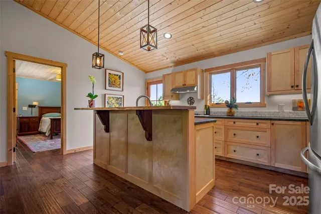 a kitchen with stainless steel appliances granite countertop a sink and cabinets