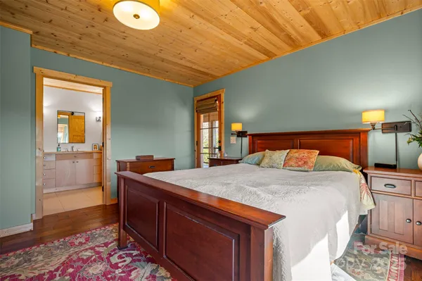 a bed room with a bed and a dresser