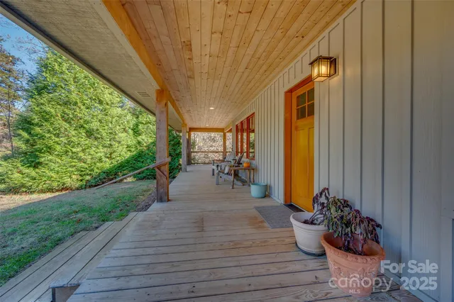 a room with wooden floor table and chairs