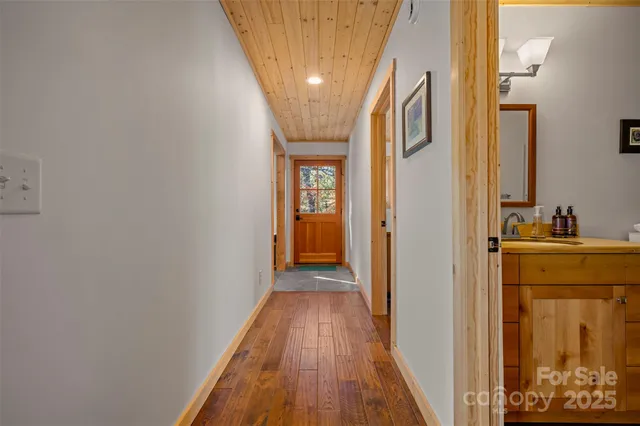 a view of gallery with wooden floor