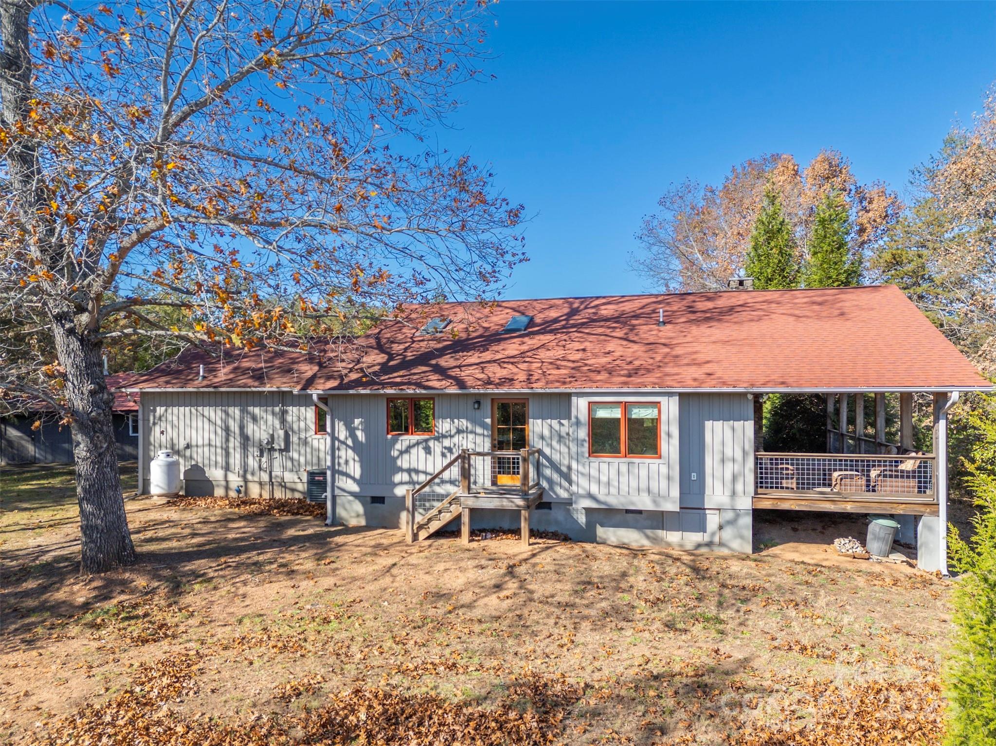 891 Meadow Crest Road Tryon, NC 28782 - Photo 31 of 47 a view of a house with backyard porch and sitting area