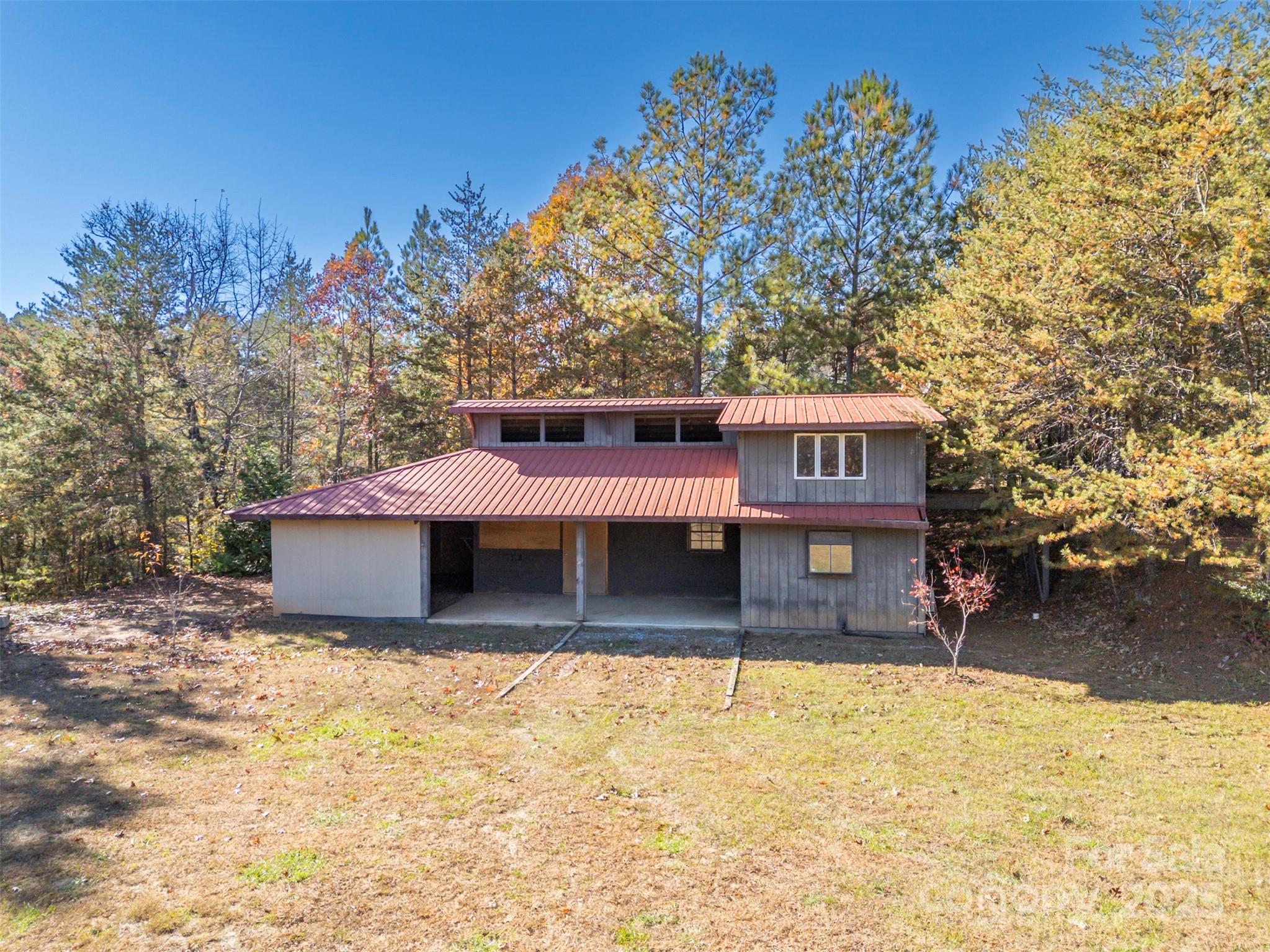 891 Meadow Crest Road Tryon, NC 28782 - Photo 33 of 47 a front view of a house with a yard covered with snow