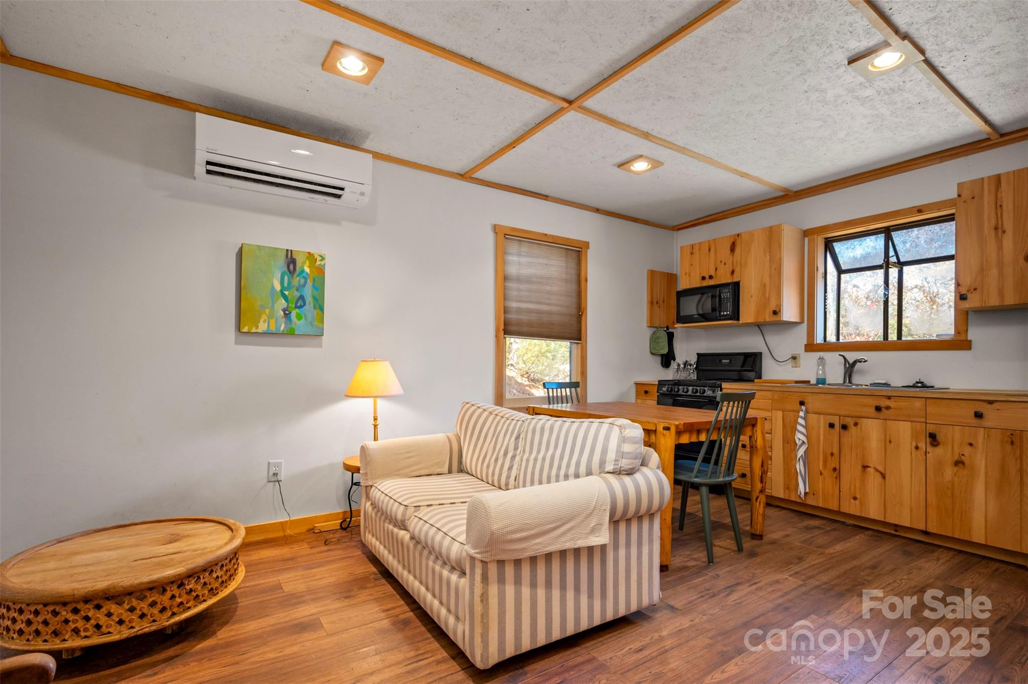 891 Meadow Crest Road Tryon, NC 28782 - Photo 34 of 47 a living room with furniture a fireplace and a flat screen tv