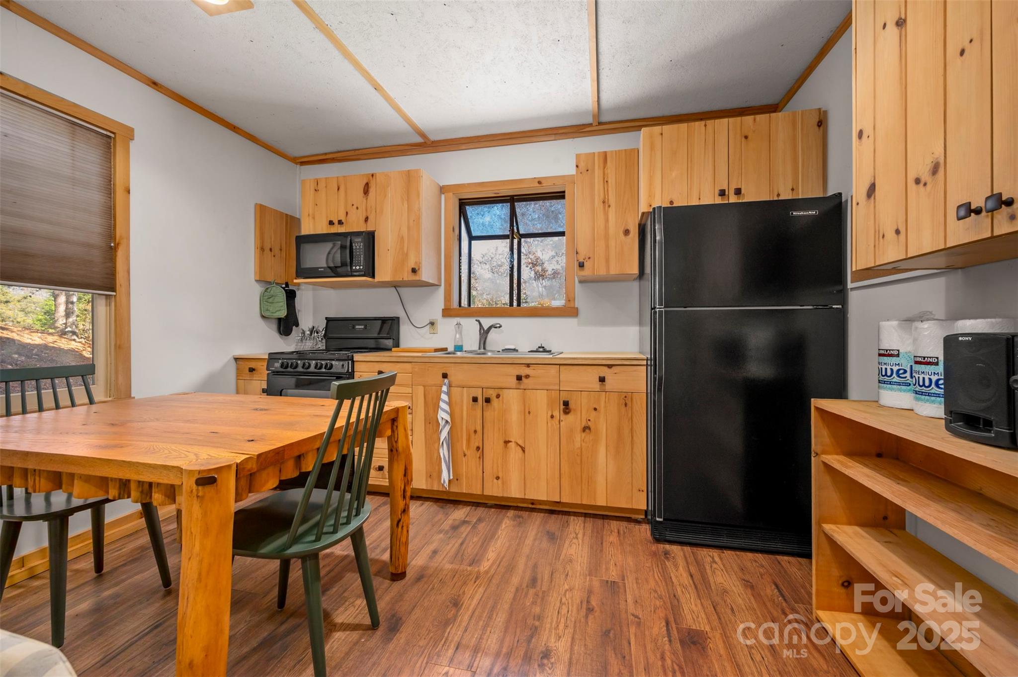 891 Meadow Crest Road Tryon, NC 28782 - Photo 35 of 47 a kitchen with stainless steel appliances granite countertop a refrigerator a sink a stove a microwave and island