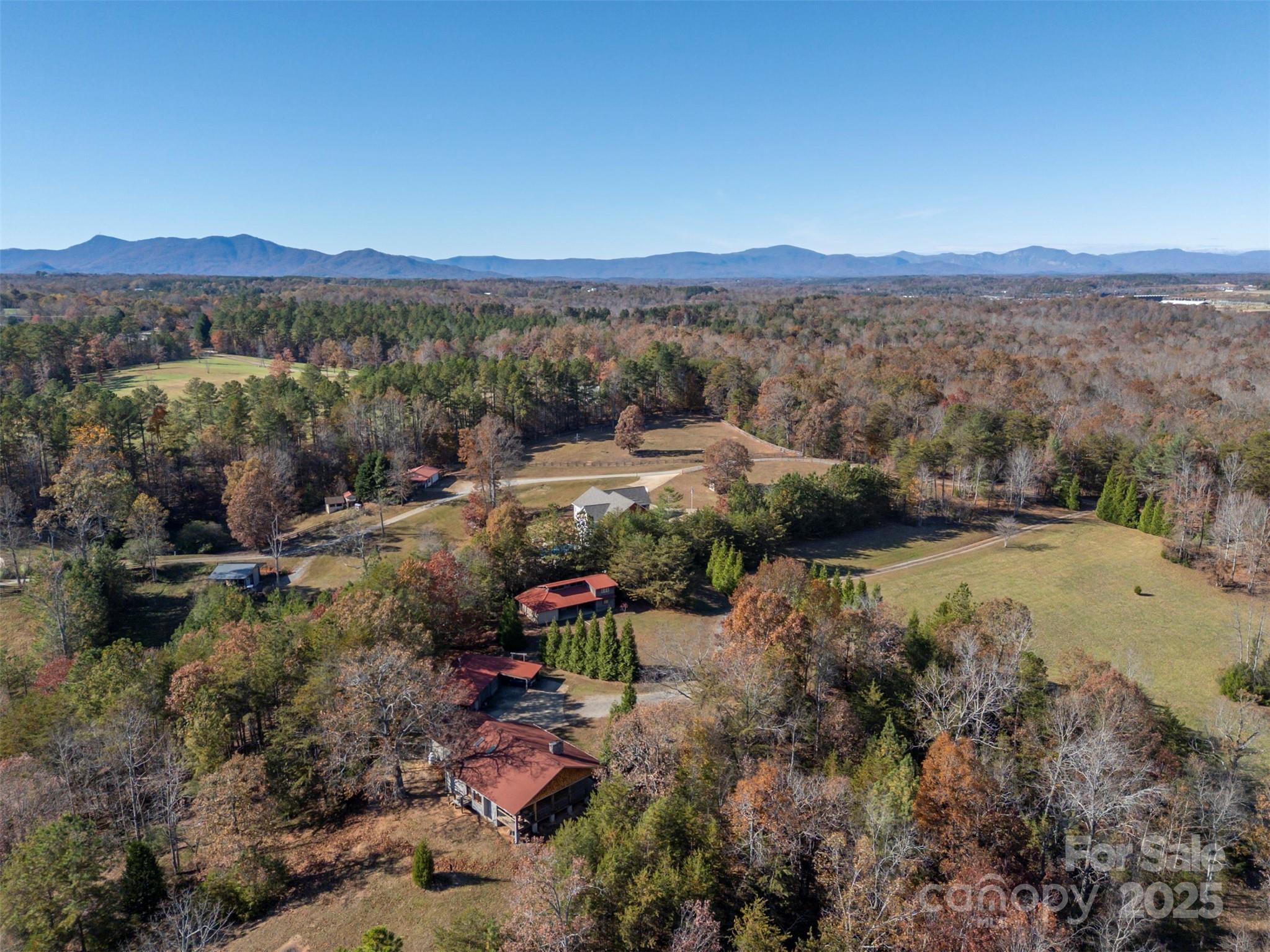 891 Meadow Crest Road Tryon, NC 28782 - Photo 46 of 47 a view of a town with mountains in the background