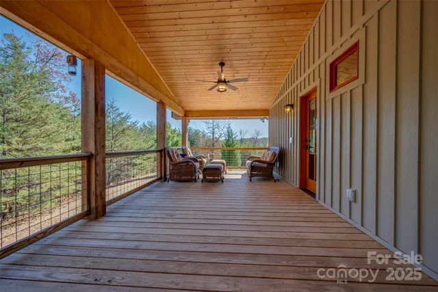 a view of a living room and balcony with furniture