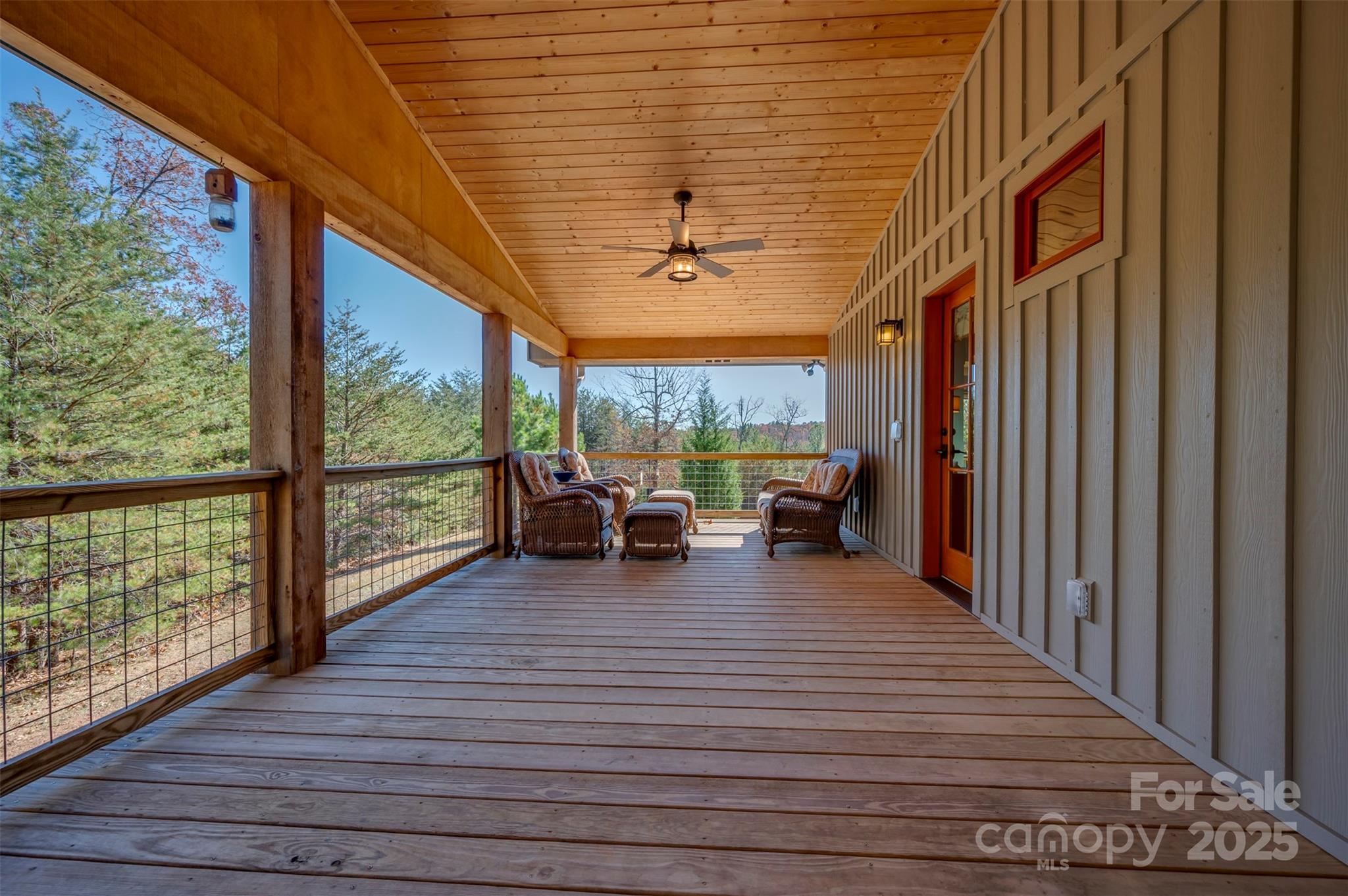 891 Meadow Crest Road Tryon, NC 28782 - Photo 5 of 47 a view of a living room and balcony with furniture