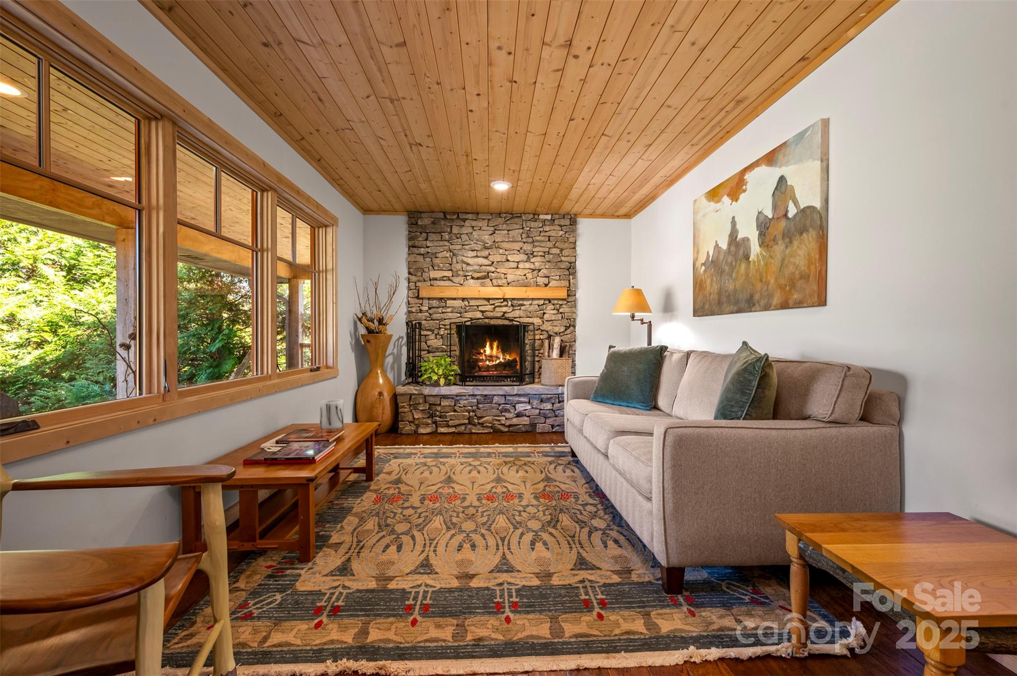 891 Meadow Crest Road Tryon, NC 28782 - Photo 10 of 47 a living room with furniture a fireplace and a large window