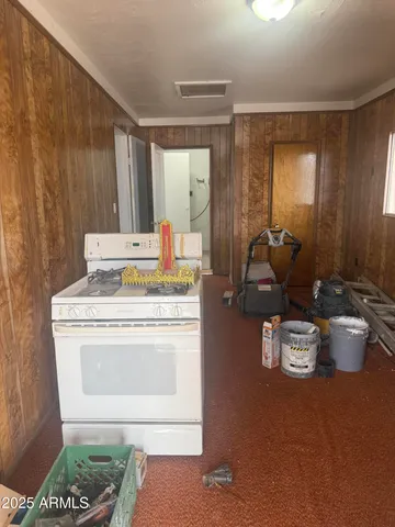 a kitchen with a stove and a sink