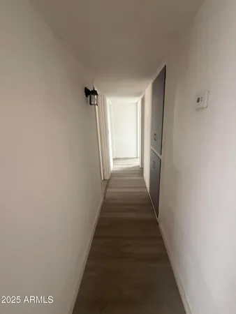 a view of a hallway with stairs