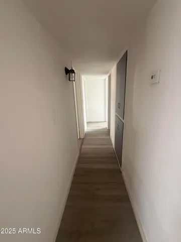 a view of a hallway with stairs